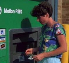 Lady using automated teller machine